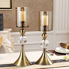 These are long and cylindrical, perfect for dining tables. Golden Glass Table Candle Holders Candle Holder Decor Candle Holders Table Candle Holders