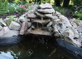 Large pond with natural stone slab bridge. Little Water Pond From Stones In Botanical Garden Waterfall Stock Photo Picture And Royalty Free Image Image 115665698