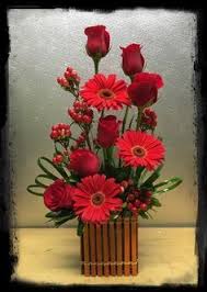 Red Roses Red Gerbera Daisies And Hypericum Floral Arrangement In A Cute Fence Cube Fresh Flowers Arrangements Rose Arrangements Red Flower Arrangements