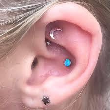 i got to upgrade this healing rook piercing i did a few weeks ago to a white gold moon it goes so well with rook piercing jewelry rook piercing conch piercing
