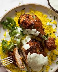 Tandoori Chicken Served With Saffron Rice And Minted Yogurt Sauce Recipetin Eats Tandoori Chicken Indian Food Recipes