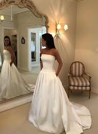White Strapless Long Prom Dress With Bow Back White Sweep Train Bridal Dress Pleated Wedding Dresses Wedding Dress With Pockets Bow Wedding Dress