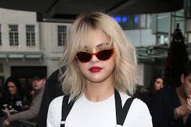 Short with wavy long bangs. Selena Gomez Tries The Curtain Bangs Hair Trend Allure