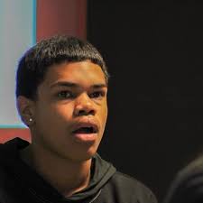 Harrison Hove, senior lecturer and interim chair of the Journalism  Department at the University of Florida, along with two of his students,  visited with journalism and media studies students at Bayshore High