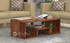 In occasional tables, darker tones and heavier materials, like a wood coffee table, take up more visual space than, say, a glass coffee table. Driftingwood Sheesham Wood Liddle Coffee Table For Living Room Center Table Light Brown Buy Online In Botswana At Botswana Desertcart Com Productid 119105563