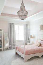 If you are looking for ideas of what kind of chandelier to place in a nursery or a bedroom, why not try pink chandeliers? Pink Girl Bedroom With Pink Tray Ceiling Transitional Girl S Room