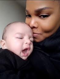 Olga Zaplishny (left) sitting outside with her daughter Martha, son-in-law  David Jackson, and grandson Jonathan Jackson (in front); 1959