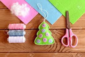 Homemade felt christmas tree decorations. Homemade Felt Christmas Tree Decor Christmas Tree Ornament Hand Crafts Idea For Kids Thread Set Hollofayber Scissors On A Wooden Table Top View Tutorial Stock Photo Picture And Royalty Free Image Image