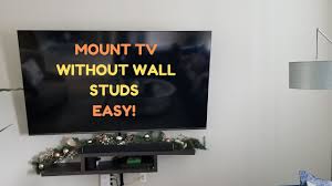 Place your tv perpendicular to the fireplace: How To Mount Tv On Wall No Studs Youtube