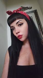 I am thrilled with my new hairstyle and headband, which channels the  classic Rosie The Riveter look. #rosietheriveter #pinuplook #pinupmodel  #rockabillystyle #rockabilly #retro #vintagestyle #carshowmodels  #classiccars