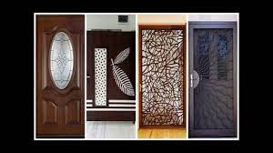A wooden double door main door design with antique handle and ganesha mural at the entrance of an indian home. 20 Modern Front Door Design For Home Assemble Decoration Ideas Flats Wood Ganesh Diy In Kerala 2018 Youtube