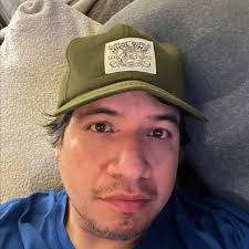 a woman is straddling the barrier of an overpass in south austin