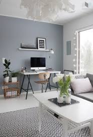 I want a big colourful rug in the center of the room and a cosy arm chair for evening reading. Syvyytta Seinaan Esmeralda S Grey Walls Living Room Blue Grey Living Room Grey Paint Living Room