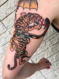 Not only the best rum on the high seas, but some brilliant inspiration for some of the coolest naval tatts around. Riff On A Sailor Jerry Traditional Design Swapping The Panther For A Tiger Courtesy Of Joe Almquist At Blue Flame In Raleigh Nc Tattoos