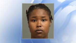 Woman charged with murder after hitting another with her car following  'dispute'