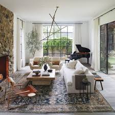 Complementing each other with their different colors and tone they will revive your living room space for sure. A Santa Monica Home Transforms Into A Worldly Abode Living Room Decor Eclectic Earthy Living Room Trendy Living Rooms