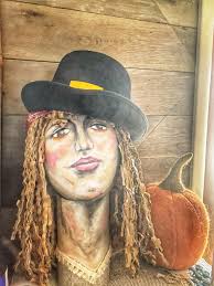 I made this from an oatmeal container and wrapped her in clothing from a  recyled tea box. The head was from an egg form my mom gave me from an after  Easter