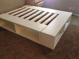 Custom storage platform bed with high cupboards and small steps. 18 Gorgeous Diy Bed Frames The Budget Decorator Diy Storage Bed Bedroom Diy Diy Bed Frame