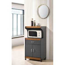 The black oak woodgrain finish on the laminated particleboard gives the microwave cart an updated look that matches your existing décor. Hodedah Microwave Kitchen Cart Grey Oak Walmart Com Walmart Com