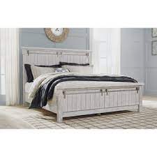 Panel bed features planked faux barn door panels with accenting metal hardware. Signature Design By Ashley Brashland Relaxed Vintage Queen Panel Bed Wayside Furniture Panel Beds