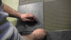 You are only going to work in one quadrant at a time. How To Tile A Shower Wall Cutting And Installing Wall Tile Youtube