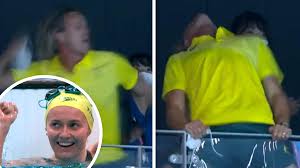 Ariarne titmus' coach had to be restrained as he wildly celebrated the australian swimmer's golden joy in tokyo. Snpklycjfszxmm