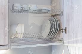 plates are dried on a shelf for dishes