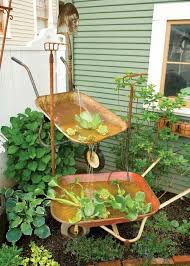 Clever Uses For Wheelbarrows You Probably Never Considered The Owner Builder Network Rustic Garden Decor Backyard Water Fountains Diy Water Feature