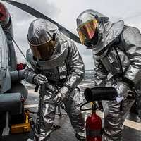 Aviation Support Equipment Technician 2nd Class Adam Haffner, from  Monroeville, Ind., directs the landing of an MV-22B Osprey from Marine  Medium Tiltrotor Squadron (VMM) 365.