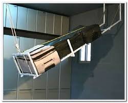 It should take up as little space as possible while also enabling you to expand and contract as the content of stuff in your garage changes, as well as make it easy to find whatever you're looking for. Overhead Garage Storage Systems Pulley Diy Overhead Garage Storage Overhead Garage Overhead Garage Storage
