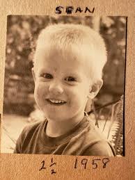 This is me as a tow head in 58 in the yard of our San Fernando home.