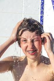 The background is this beautiful pic of colette standing in the shower. Cute Boy Has Fun Unter The Pool Shower Stock Photo Picture And Royalty Free Image Image 14136538