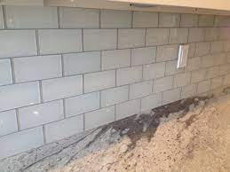 The contrasting grout warms up the white tile, preventing any sense of sterility while adding depth and dimension. White Glass Tile Grey Grout Google Search White Glass Tile Grey Glass Tiles Glass Tile
