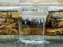 These elegant natural river stone fountain are handmade, skillfully crafted, and perfect for elevated garden decorations. Water Features Indian River Orchid Island Vero Beach Fl