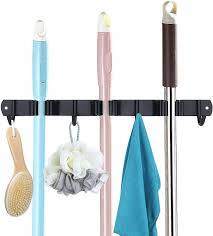 Many brooms, mops and dustpans have some kind of hole going through the end of the handle. Cavogue Mop Broom Holder Wall Mounted Heavy Duty Tool Organizer Stainless Steel Garage Storage 3 Racks 4 Hooks 15 Garden Tools Ha