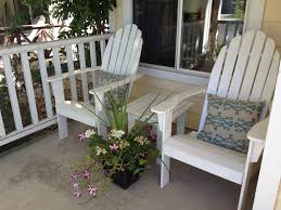 Here, a beautiful stone path leads the way to an elevated patio. Front Porch Furniture Design