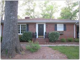 The lines of the house are very good, more decorative you don't need. Red Brick Ranch House With Black Windows Novocom Top