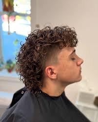 Low partial fade with a permed mullet