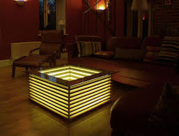 This coffee table is square but not a boring cube. Sqill Illuminating Coffee Table By David Chapman Glows Like A Lamp Homecrux