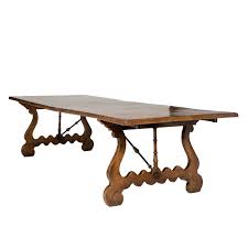 We ordered a farmhouse dining table. An Impressive Italian Burl Ash And Walnut Trestle Table With Harp Shaped Bases And Wrought Iron Stretcher Circa 1880 Garden Court Antiques