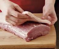 Do you trim the fat off a pork loin before cooking?