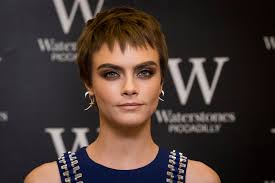 Prior to going brunette, the model and actress worked a blonde pixie cut that read a bit edgier. Cara Delevingne Dyed Her Pixie Chocolate Brown Predictably Looks Awesome Glamour