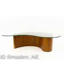 A unique material mix refreshes the classic nesting table. Vladimir Kagan Mid Century Modern Comma Coffee Table
