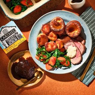 Classic Yorkshire puddings served with a Sunday roast, AI generated
