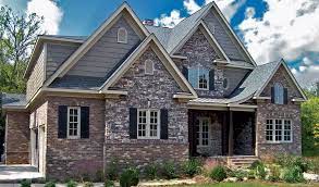 All of our craftsman house plans are artistically inspired by the american craftsman movement that traditionally features tapered columns, exposed. Craftsman House With Brick And Stone Exterior Home Decoration Craftsman House Stone Exterior Houses Craftsman Exterior