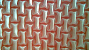 Sulaman aplikasi adalah sebuah teknik menghias busana yang meletakkan selembar kain yang telah dibentuk sesuai keinginan pada kain yang akan dihias dimana cara menempelkan kain yang telah dibentuk tersebut menggunakan tusuk hias, yaitu tusuk feston. Blus Pesta Berhias Smock Hasta Karya Novi Kurnia