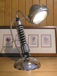 This Old School Shock Lamp Has A Vintage Brass And Chrome Headlight Chrome Harley Davidson Shock And An H Industrial Bathroom Decor Lamp Automotive Furniture