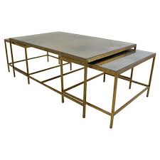 The living room isn't complete without a modern coffee table. Oly Studio Jonathan Gold Mirrored Nesting Rectangular Coffee Table Set Of 3 41 W 50 W Kathy Kuo Home