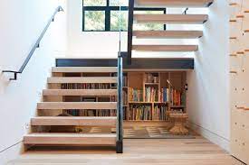 A compact ladder and a trapdoor designed in minimalist style provide access to the attic. 18 Smart And Surprising Under Stair Storage Solutions Dwell