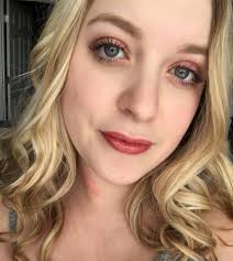 Passport photo with styled locs and makeup